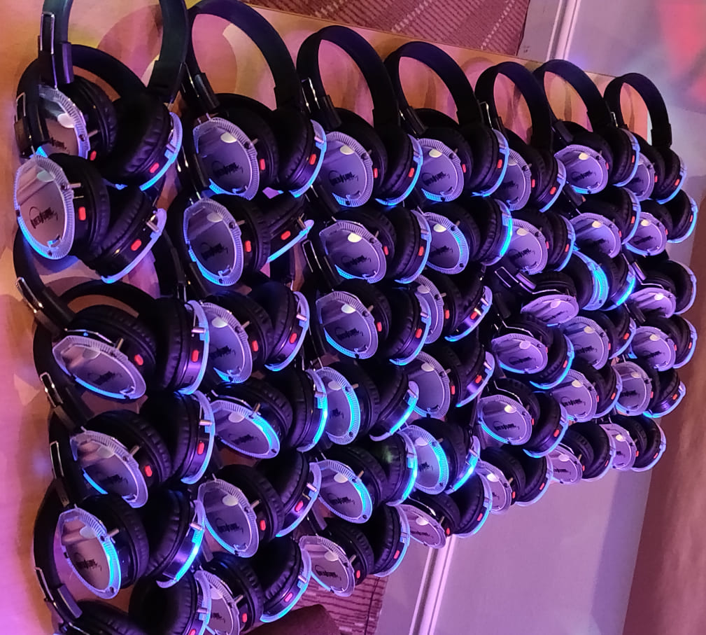 large amount of silent disco headphones in blue