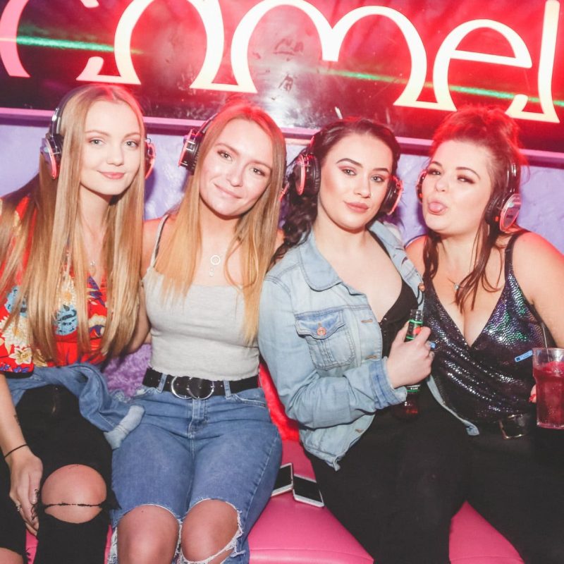 group of friends enjoying silent disco at the camel club in huddersfield